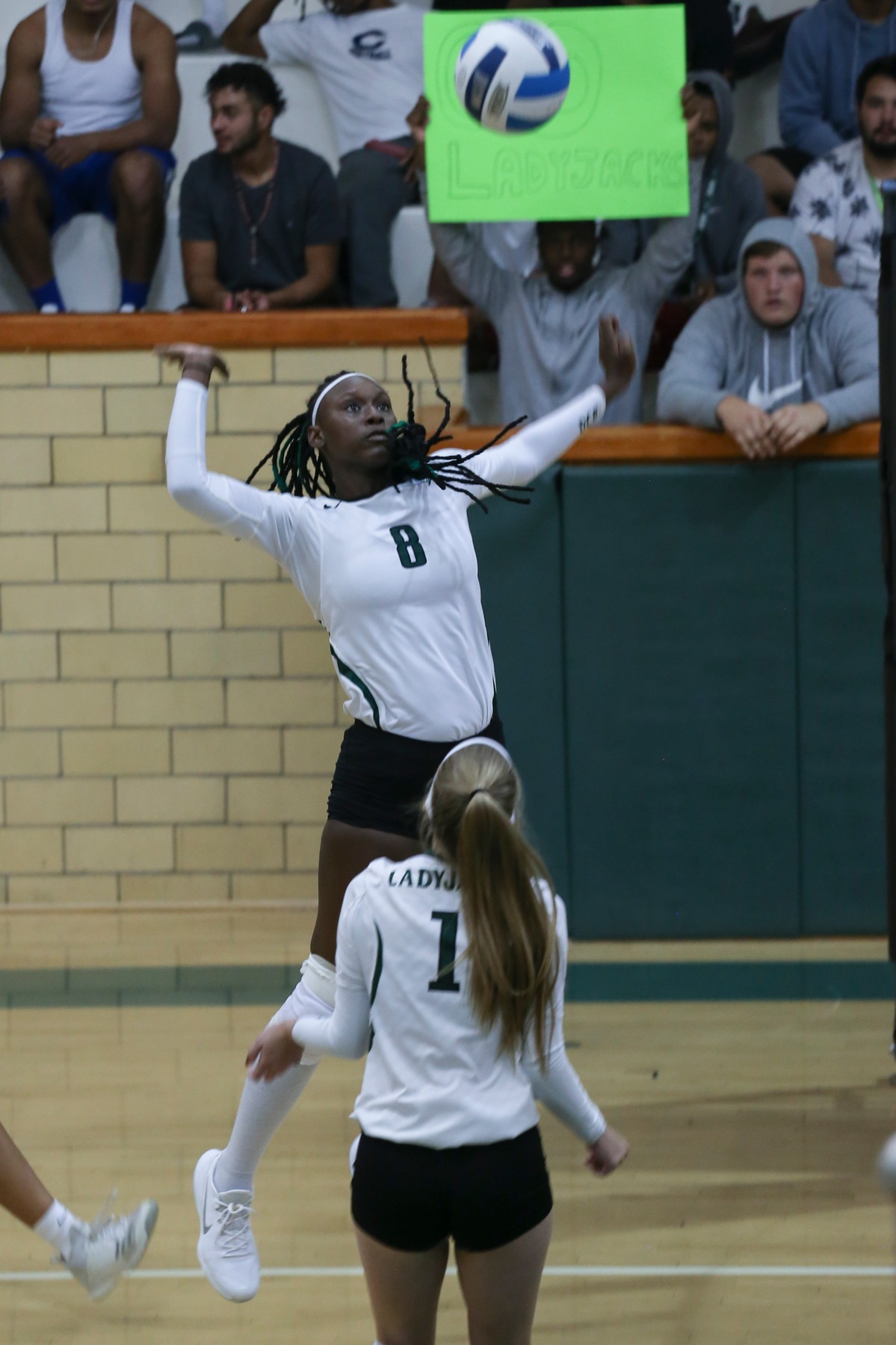 Newcomer Tiandre Stuart gets ready to hit a pass from freshman setter Sam Harris in volleyball action this past week.