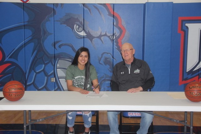 Dunseith Dragons Senior Lexius Davis has signed a Letter of Intent and will suit up for the DCB Ladyjacks next season.  Lexius with Head Basketball coach Wayne Johnson.